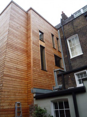 The rear extension of the Dickens Museum on Doughty Street is both over bulky and uses completely inappropriate materials. The effort to 'make a statement' has over-ridden the need to be neighbourly.