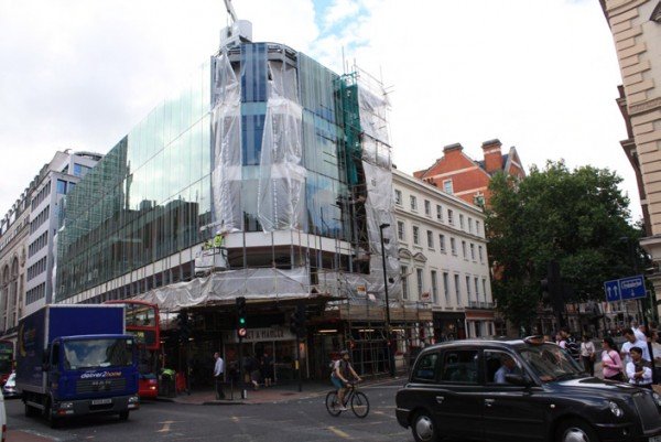 New Oxford Street - Over-scaled glass faced crashes into the listed rendered building on Bloomsbury Way.
